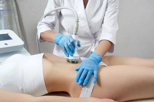 Lost the Weight but Not the Loose Skin? 2 woman having HIFU treatment on her stomach to combat loose skin Bracknell following weight loss